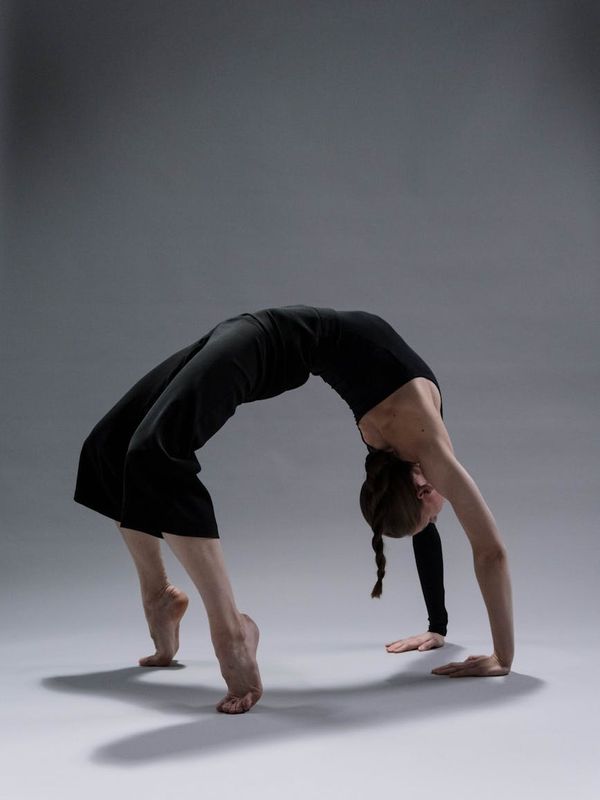 Person practicing yoga for joint flexibility and movement control